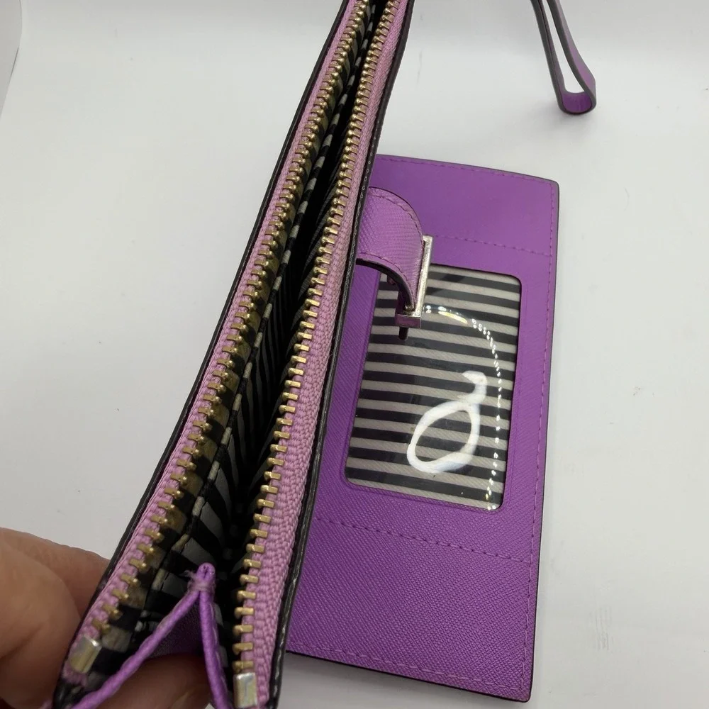 Kate Spade New York purple leather wristlet.